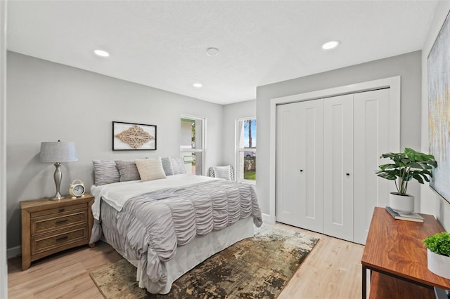4012 Marine Pkwy, New Port Richey, FL 34652 - bedroom featuring a closet, light wood-style floors, and recessed lighting