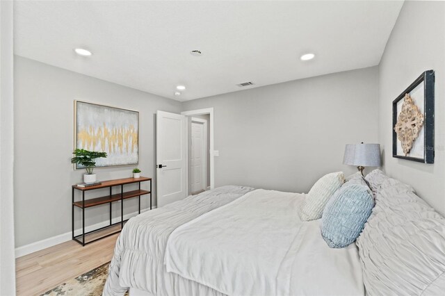 4012 Marine Pkwy, New Port Richey, FL 34652 - bedroom featuring light wood-style flooring, recessed lighting, and baseboards