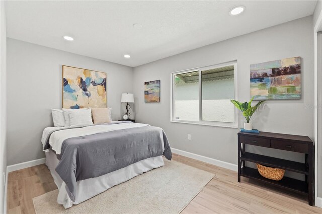 4012 Marine Pkwy, New Port Richey, FL 34652 - bedroom with light wood-style flooring, baseboards, and recessed lighting