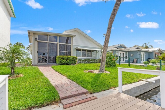4012 Marine Pkwy, New Port Richey, FL 34652 - back of house featuring a sunroom and french doors
