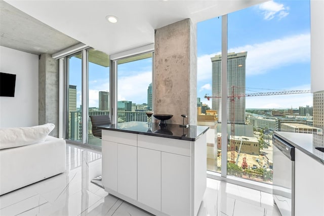 777 N Ashley Dr Unit 1506, Tampa, FL 33602 - living area with expansive windows, a view of city, plenty of natural light, and light tile patterned floors