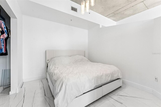 777 N Ashley Dr Unit 1506, Tampa, FL 33602 - bedroom with light marble finish flooring and baseboards