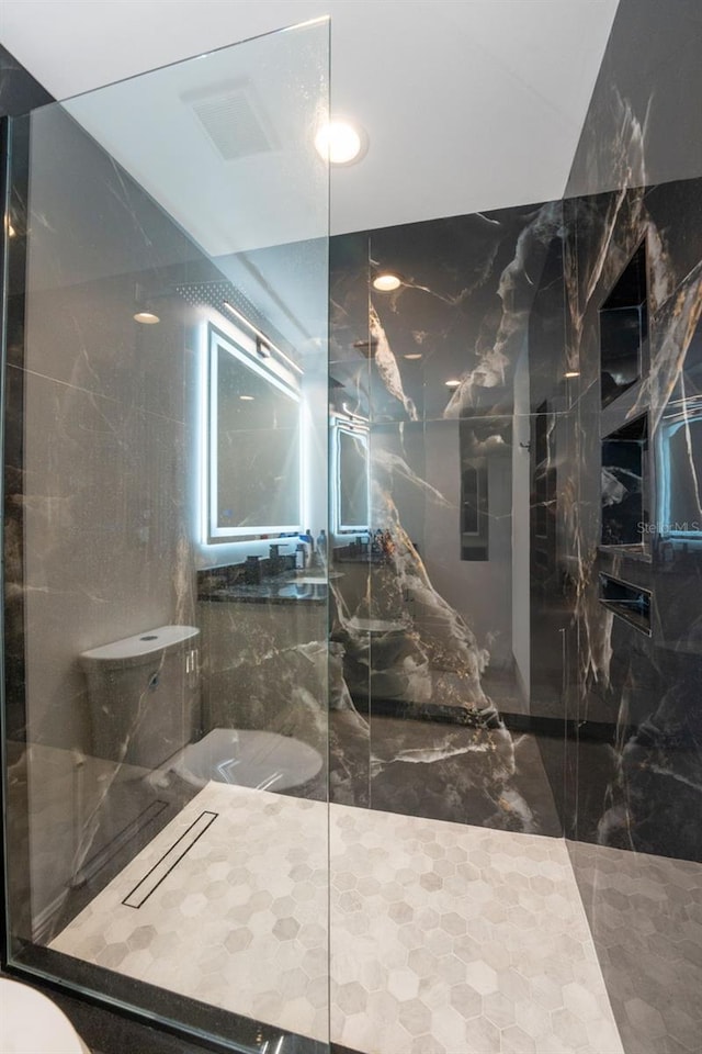777 N Ashley Dr Unit 1506, Tampa, FL 33602 - full bathroom with toilet, a marble finish shower, and marble tiled flooring