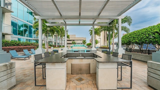 777 N Ashley Dr Unit 1506, Tampa, FL 33602 - view of patio / terrace featuring a pergola and an outdoor kitchen