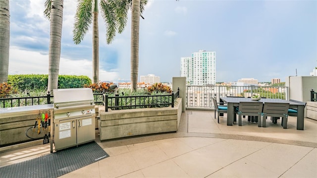 777 N Ashley Dr Unit 1506, Tampa, FL 33602 - view of patio with area for grilling, outdoor dining space, and a city view