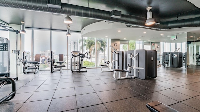 777 N Ashley Dr Unit 1506, Tampa, FL 33602 - workout area featuring expansive windows, a view of city, and recessed lighting