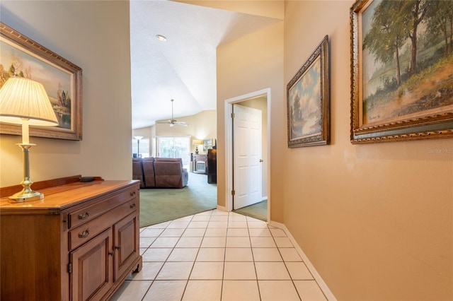 2024 Glen Forge St, Brandon, FL 33511 - hallway with light colored carpet, lofted ceiling, light tile patterned floors, and baseboards