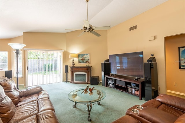 2024 Glen Forge St, Brandon, FL 33511 - carpeted living room with ceiling fan, a fireplace, high vaulted ceiling, and baseboards