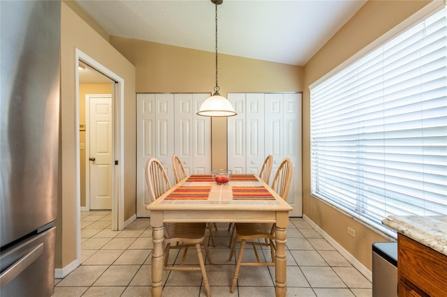 2024 Glen Forge St, Brandon, FL 33511 - dining space featuring light tile patterned floors, lofted ceiling, plenty of natural light, and baseboards