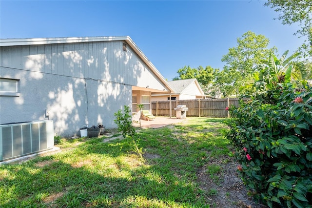 2024 Glen Forge St, Brandon, FL 33511 - rear view of house with central AC unit and a patio