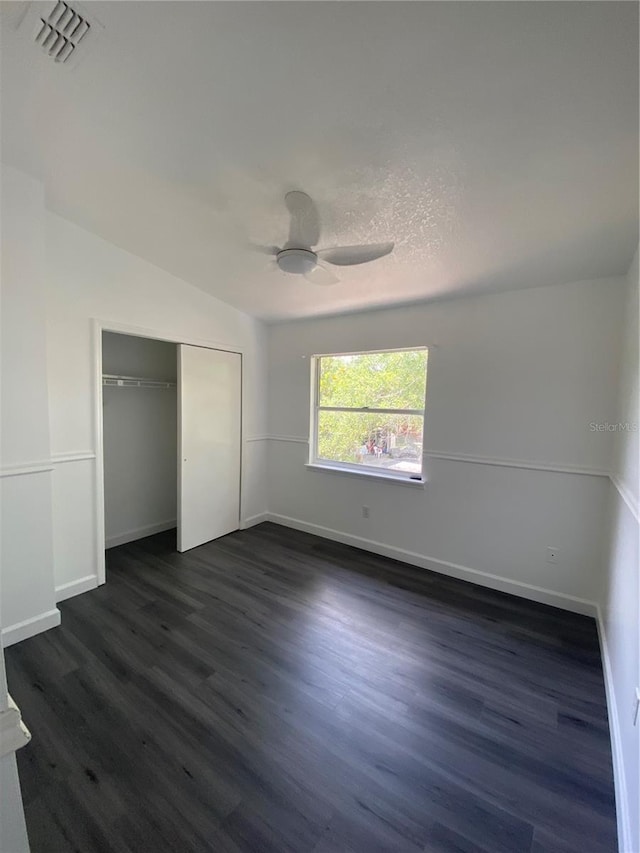 8708 Cobbler Pl, Tampa, FL 33615 - unfurnished bedroom featuring a closet, dark wood-type flooring, baseboards, and ceiling fan