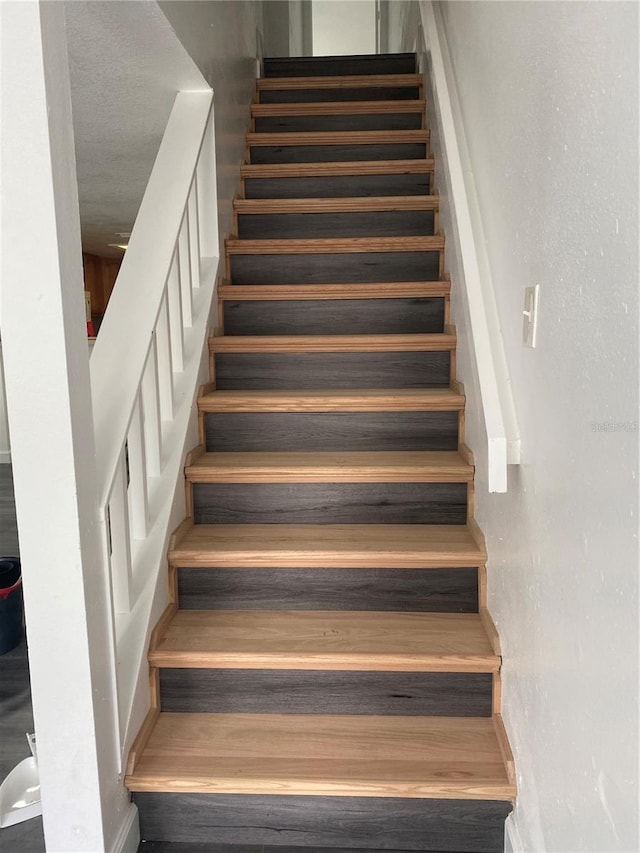 8708 Cobbler Pl, Tampa, FL 33615 - stairs featuring baseboards
