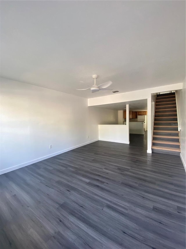 8708 Cobbler Pl, Tampa, FL 33615 - unfurnished living room featuring stairway, dark wood finished floors, a ceiling fan, and baseboards
