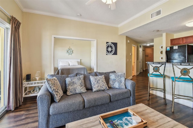 10315 Gulf Blvd Unit 302, Saint Petersburg, FL 33706 - living room featuring dark wood-style flooring, ornamental molding, a ceiling fan, and baseboards