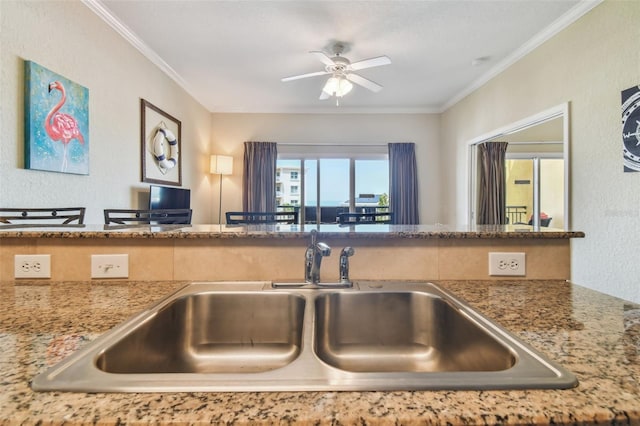 10315 Gulf Blvd Unit 302, Saint Petersburg, FL 33706 - kitchen with a sink, a ceiling fan, and crown molding