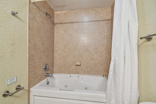 10315 Gulf Blvd Unit 302, Saint Petersburg, FL 33706 - full bath featuring a textured wall and a combined bath / shower with jetted tub