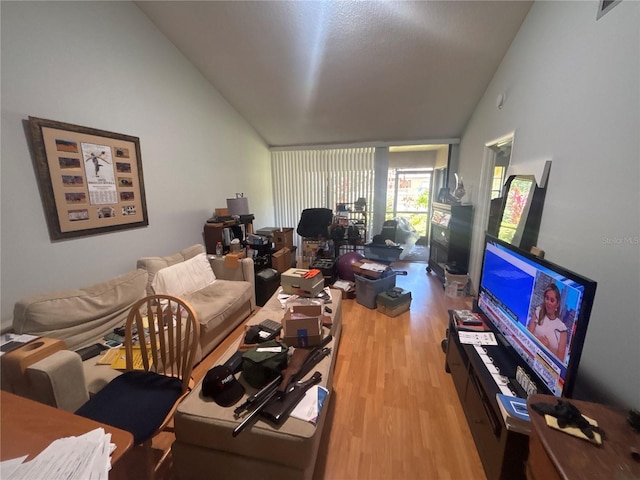 4558 Morningside Unit 43, Sarasota, FL 34235 - living area featuring vaulted ceiling and wood finished floors