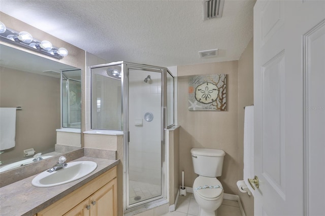 full bath featuring vanity, a textured ceiling, a stall shower, and tile patterned floors
