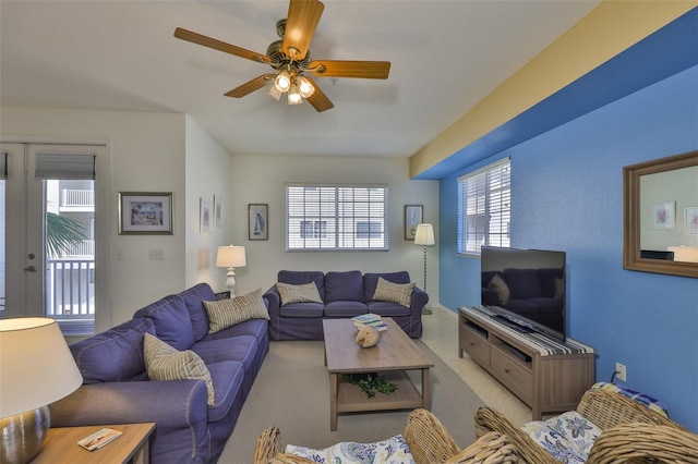 living area with a ceiling fan