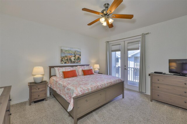 bedroom featuring access to exterior, ceiling fan, and light colored carpet