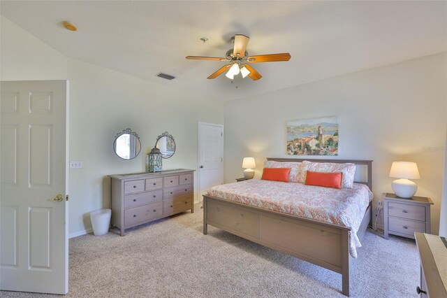 bedroom featuring light colored carpet and ceiling fan