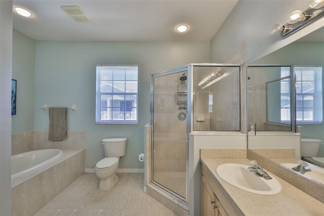 full bath with vanity, tile patterned floors, a garden tub, and a shower stall