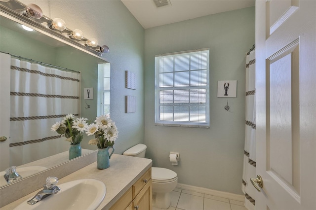 bathroom with tile patterned floors, vanity, and a shower with curtain