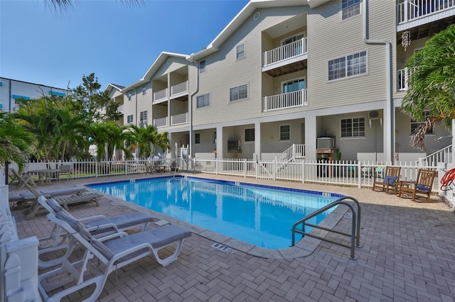 community pool featuring a patio area