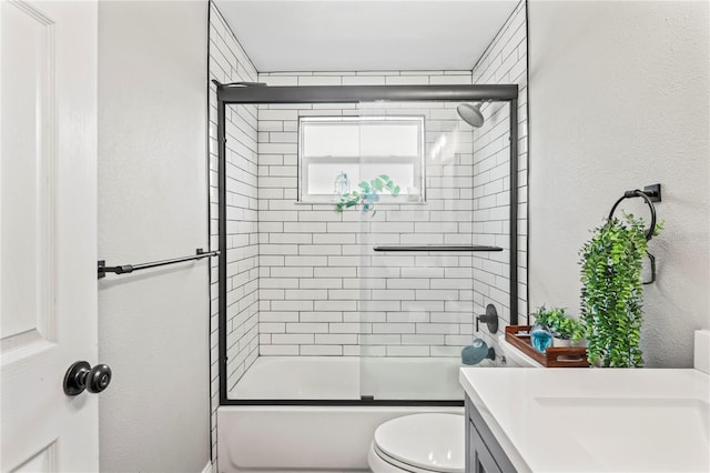 6137 Halifax Dr, New Port Richey, FL 34653 - bathroom with vanity, combined bath / shower with glass door, toilet, and a textured wall