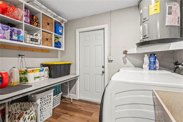 6137 Halifax Dr, New Port Richey, FL 34653 - laundry area featuring water heater, separate washer and dryer, and light wood-style flooring