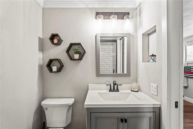 6137 Halifax Dr, New Port Richey, FL 34653 - half bathroom featuring toilet, vanity, wood finished floors, and a textured wall