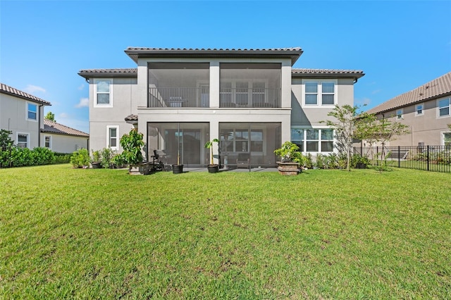 33255 Kateland Dr, Wesley Chapel, FL 33545 - back of house with stucco siding, a tile roof, and a sunroom