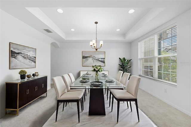 33255 Kateland Dr, Wesley Chapel, FL 33545 - dining area featuring a tray ceiling, a chandelier, baseboards, recessed lighting, and light carpet