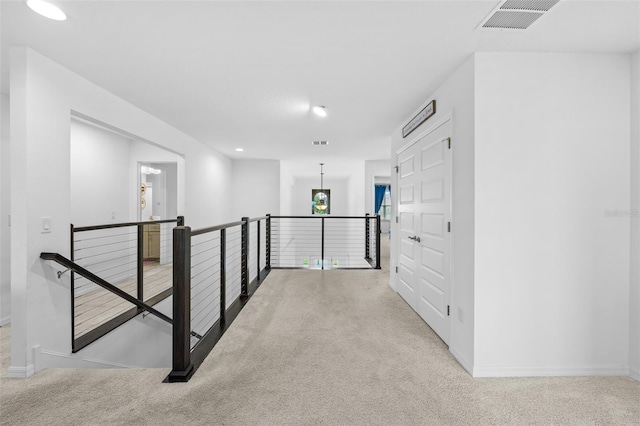 33255 Kateland Dr, Wesley Chapel, FL 33545 - hallway featuring an upstairs landing, carpet, baseboards, and recessed lighting