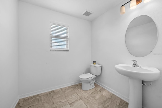 33255 Kateland Dr, Wesley Chapel, FL 33545 - half bath with baseboards, toilet, and a sink