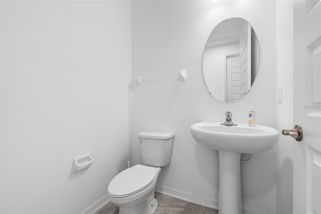 33255 Kateland Dr, Wesley Chapel, FL 33545 - half bath featuring toilet and baseboards