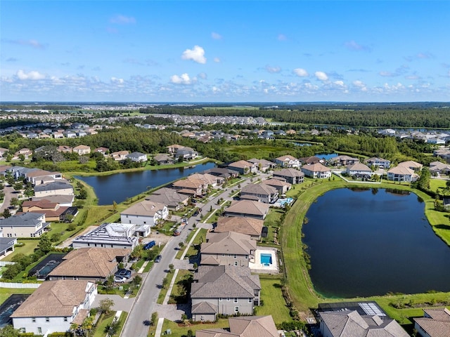 33255 Kateland Dr, Wesley Chapel, FL 33545 - aerial perspective of suburban area with a nearby body of water