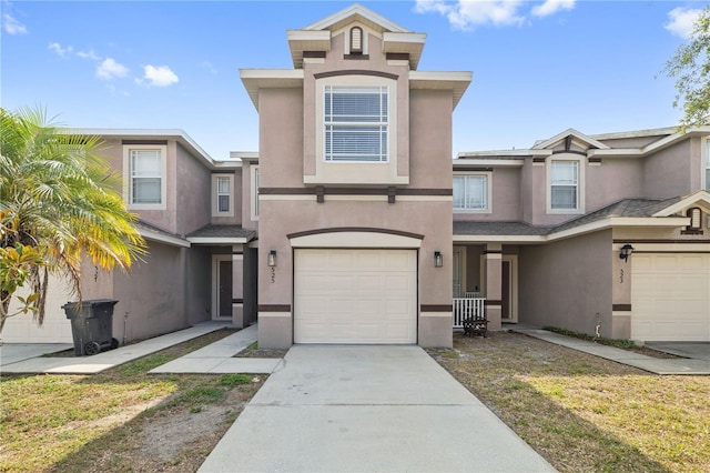 527 Glenn Cross Dr, Ruskin, FL 33570 - view of front of property with a garage, stucco siding, and driveway