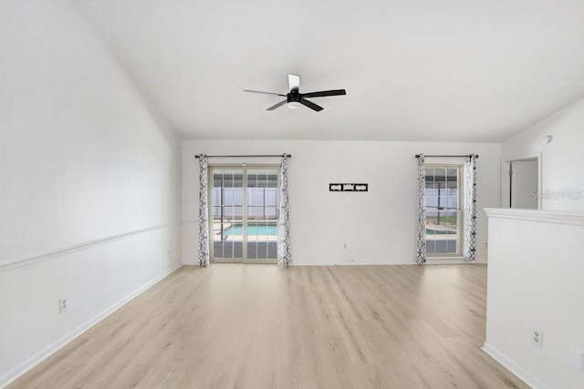 1017 Cameo Crest Ln, Valrico, FL 33596 - empty room with wood finished floors, a ceiling fan, and baseboards
