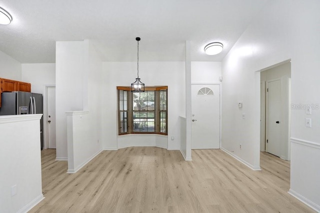 1017 Cameo Crest Ln, Valrico, FL 33596 - foyer featuring light wood-style flooring and baseboards