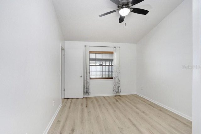 1017 Cameo Crest Ln, Valrico, FL 33596 - empty room with wood finished floors, lofted ceiling, baseboards, and a ceiling fan