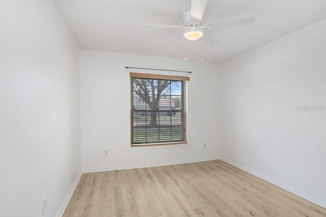 1017 Cameo Crest Ln, Valrico, FL 33596 - unfurnished room featuring light wood-style floors, a ceiling fan, and baseboards