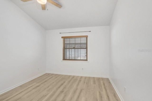 1017 Cameo Crest Ln, Valrico, FL 33596 - spare room with vaulted ceiling, light wood-style flooring, ceiling fan, and baseboards