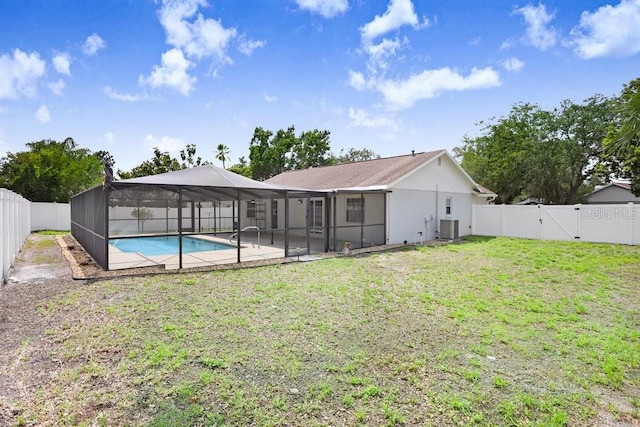 1017 Cameo Crest Ln, Valrico, FL 33596 - rear view of property with cooling unit, a gate, a lanai, and a patio