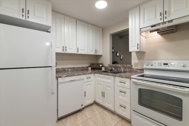 11485 Oakhurst Rd Unit 200-101, Largo, FL 33774 - kitchen featuring white appliances, a sink, white cabinetry, and light tile patterned flooring
