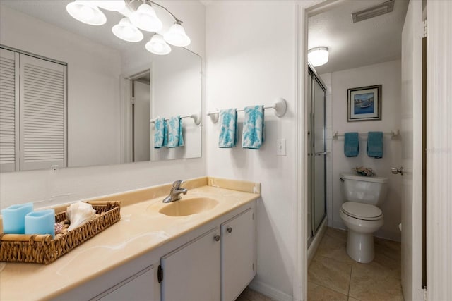 11485 Oakhurst Rd Unit 200-101, Largo, FL 33774 - full bath featuring toilet, vanity, a shower stall, tile patterned flooring, and a chandelier