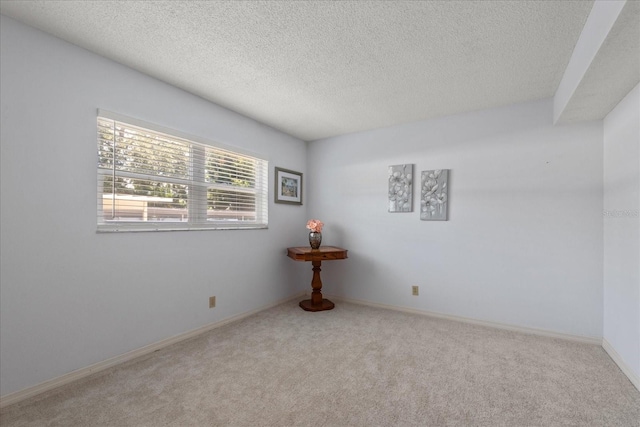 11485 Oakhurst Rd Unit 200-101, Largo, FL 33774 - carpeted empty room featuring a textured ceiling and baseboards
