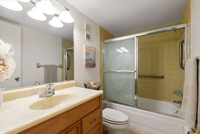 11485 Oakhurst Rd Unit 200-101, Largo, FL 33774 - full bathroom with toilet, vanity, shower / bath combination with glass door, and tile patterned flooring