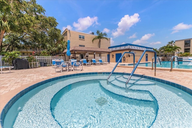 11485 Oakhurst Rd Unit 200-101, Largo, FL 33774 - community pool featuring a patio