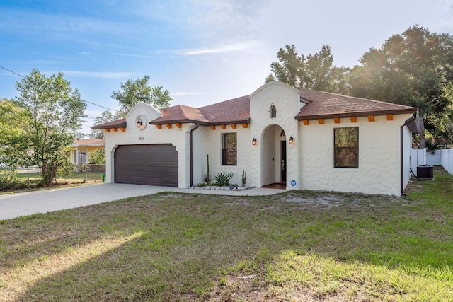 8523 N Newport Ave, Tampa, FL 33604 - mediterranean / spanish-style home with central AC, a garage, driveway, and stucco siding